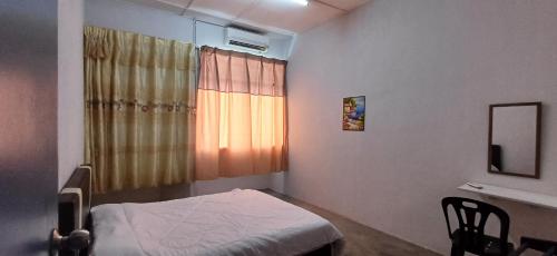 a hospital room with a bed and a window at Cozy Nature Homestay - Free Wifi Disney Hotstar ADS in Nibung Tebal