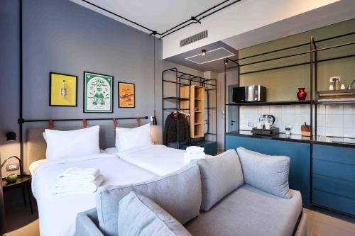a bedroom with a large bed and a couch at Brassbell l DT l Hannaux l Tahrir sq in Cairo