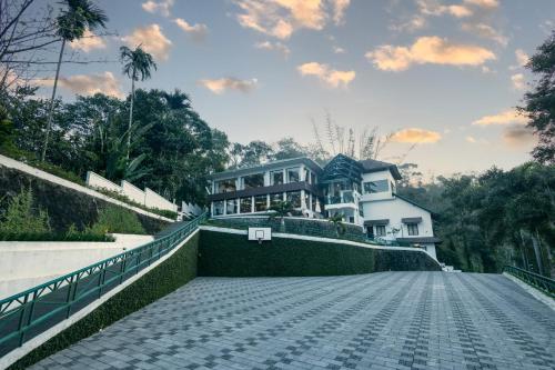 a house on the side of a road at Forest Canopy Thekkady in Thekkady