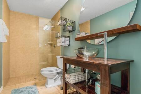 a bathroom with a sink and a toilet in it at Casa Comares, Overlooks Lighthouse, Near DT + Bch! in Saint Augustine