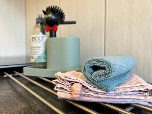 a pile of towels sitting on top of a counter at Pension am Plan in Herzberg