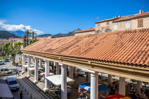 an overhead view of a building with a tile roof at Résidence Côté Sud in LʼÎle-Rousse