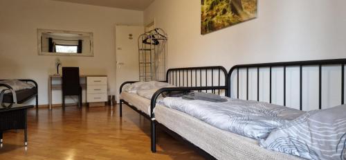 a room with two beds and a desk in it at Haus Mitterfeld in Kasten bei Böheimkirchen