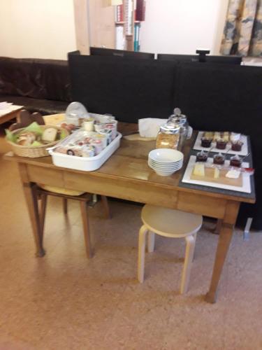 a wooden table with food on top of it at Beat & Ursula's Guest House in Jenaz