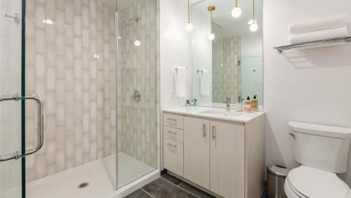 a bathroom with a shower and a toilet and a sink at Landing - Modern Apartment with Amazing Amenities (ID5157X18) in Portland