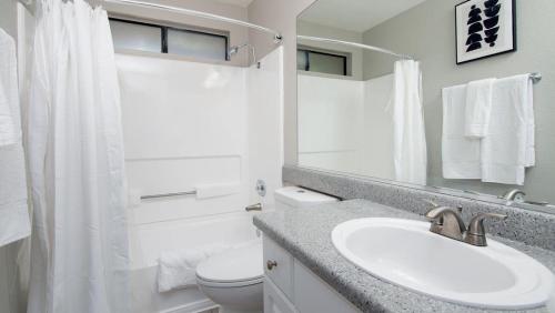 a white bathroom with a sink and a toilet at Landing - Modern Apartment with Amazing Amenities (ID8704X95) in Redlands