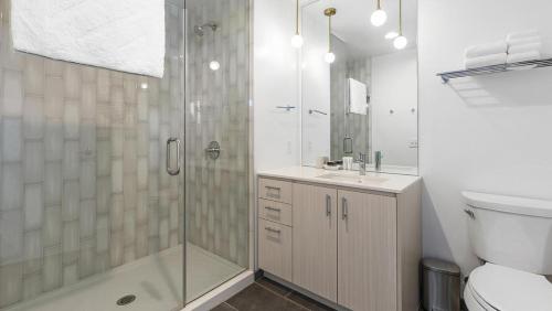 a bathroom with a shower and a toilet and a sink at Landing - Modern Apartment with Amazing Amenities (ID1187X358) in Portland