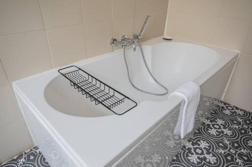 a white bath tub with a keyboard in it at Tings Lisbon in Lisbon