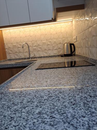 Η κουζίνα ή μικρή κουζίνα στο Ada APART&HOTEL