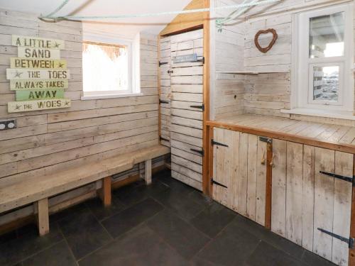 a sauna with two benches and a window at The Vines in Bridgend