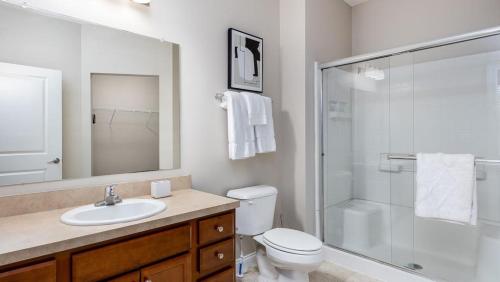 a bathroom with a toilet sink and a shower at Landing - Modern Apartment with Amazing Amenities (ID4410X01) in Lewis Center