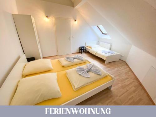 a bedroom with two beds in a attic at Hotel Lamm in Pforzheim