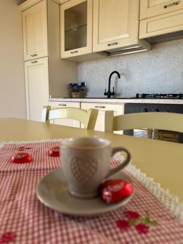 a cup of coffee on a table in a kitchen at Holiday Home Sovenigo in Puegnago
