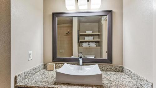 a bathroom with a sink and a mirror at Landing - Modern Apartment with Amazing Amenities (ID7779X23) in Austin