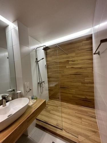 a bathroom with a shower and a sink and a shower at Chiko Group in Aspindza