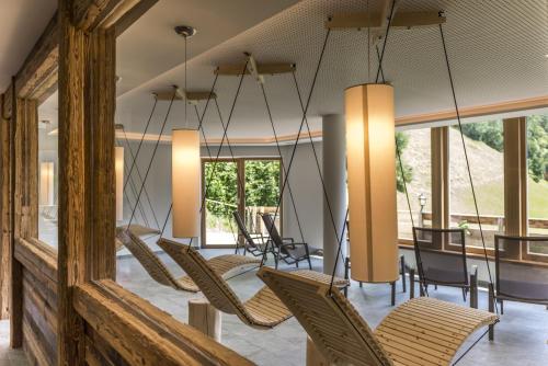 a dining room with chairs and a table at Hotel Panorama in Fleres