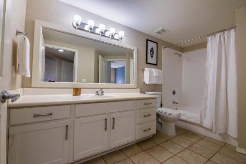 a bathroom with a sink and a toilet and a mirror at Landing - Modern Apartment with Amazing Amenities (ID1793X49) in Phoenix