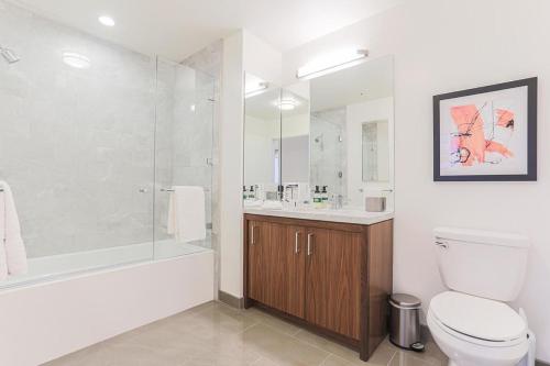 a bathroom with a tub and a toilet and a shower at Landing - Modern Apartment with Amazing Amenities (ID2652) in Los Angeles