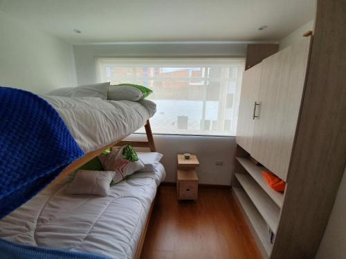 Postel nebo postele na pokoji v ubytování HOMY APARTAMENTOS - Corferias, embassy, airport, G12, UN, Agora