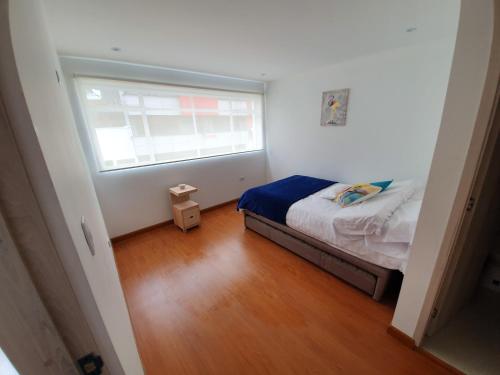 Postel nebo postele na pokoji v ubytování HOMY APARTAMENTOS - Corferias, embassy, airport, G12, UN, Agora