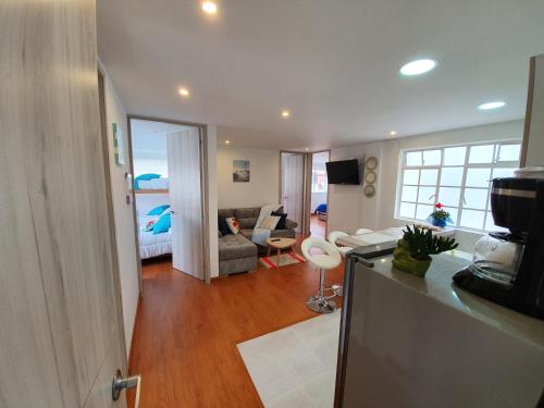 TV a/nebo společenská místnost v ubytování HOMY APARTAMENTOS - Corferias, embassy, airport, G12, UN, Agora
