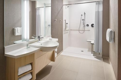 a bathroom with a sink and a shower at SpringHill Suites by Marriott Franklin Mint in Franklin