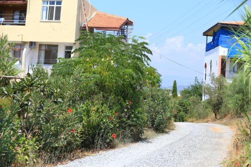 a dirt road in front of a building at Sercan Apart in Kızılot