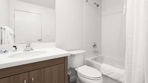 a bathroom with a sink and a toilet and a tub at Landing - Modern Apartment with Amazing Amenities (ID7668X57) in Oakland