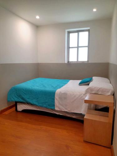Postel nebo postele na pokoji v ubytování HOMY APARTAMENTOS - Corferias, embassy, airport, G12, UN, Agora