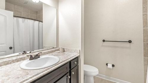 a bathroom with a sink and a toilet at Landing - Modern Apartment with Amazing Amenities (ID7367X45) in Jacksonville