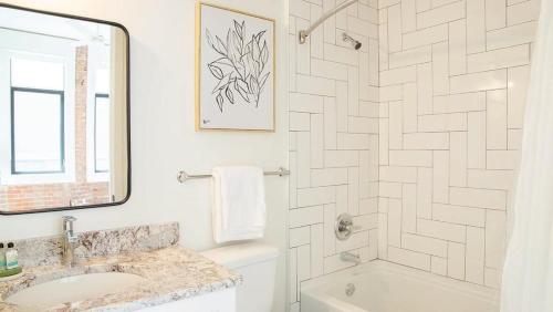 a white bathroom with a sink and a shower at Landing - Modern Apartment with Amazing Amenities (ID5790X33) in Birmingham