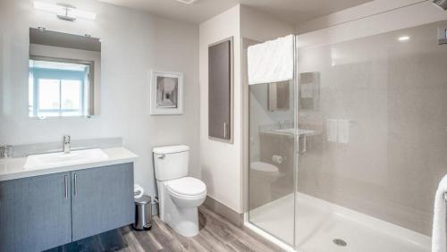 a bathroom with a toilet and a sink and a shower at Landing - Modern Apartment with Amazing Amenities (ID2499X88) in San Jose