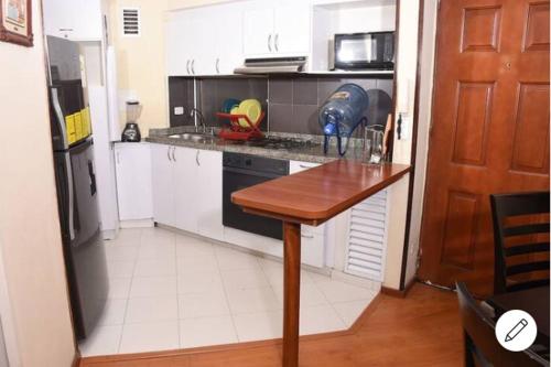 Kuchyň nebo kuchyňský kout v ubytování HOMY APARTAMENTOS - Corferias, embassy, airport, G12, UN, Agora