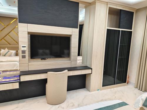 TV a/nebo společenská místnost v ubytování Elaf Suites Al Hamra