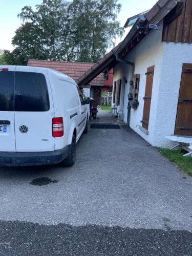 a white van parked in front of a house at L Annexe in Mittlach