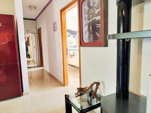 a room with a glass table and a mirror at CastleView 2BR Spacious Apartment with City View in Thessaloniki