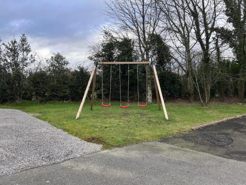 a swing set on the side of a road at The Old School House *New* in Coagh