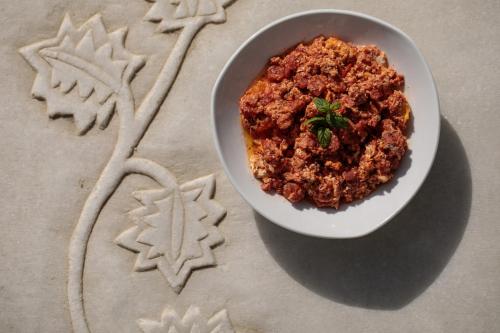 a bowl of food sitting on top of a table at Iria Beach Art Hotel in Agia Anna Naxos