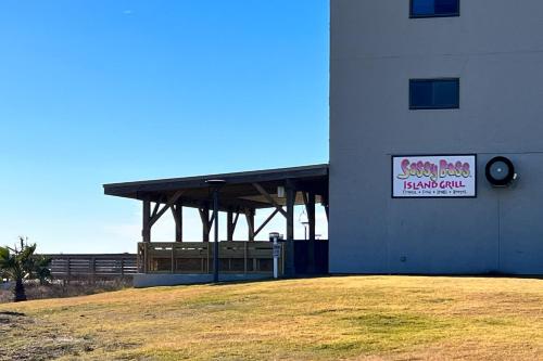 a building with a sign on the side of it at Plantation East #3219 in Gulf Highlands