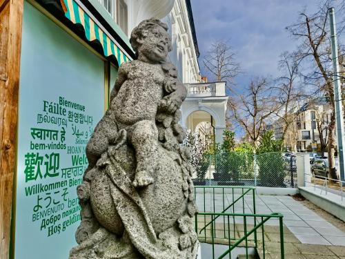 a statue in front of a building with a building at Sievering18 A-B in Vienna