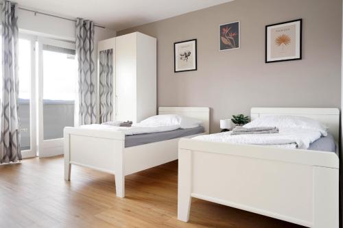 Ένα ή περισσότερα κρεβάτια σε δωμάτιο στο Schöne Apartments in Bad Rothenfelde I private Parkplätze mit Ladesäulen I home2share
