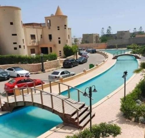 a bridge over a river with cars on a street at شاليه ديمورا عائلات فقط Dimora Chalet Only Family in Dawwār Muḩammad Abū Shunaynah