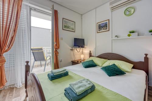 Posteľ alebo postele v izbe v ubytovaní Studio Apartmani Ivanda