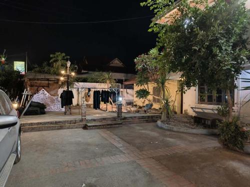 a house at night with clothes hanging outside of it at ShuYa Hotel 舒雅酒店 in Luang Prabang