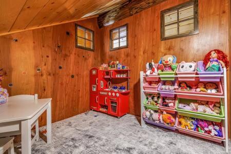 a room with a toy store in a house at Luxury Family Cabin at Summit West in Snoqualmie Pass