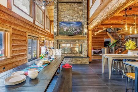 a large room with a long wooden table in a house at Luxury Family Cabin at Summit West in Snoqualmie Pass