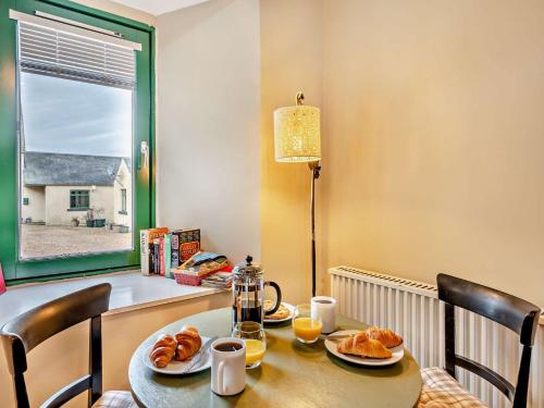 a table with two plates of croissants on it at 1 Bed in Dunning CA333 in Dunning