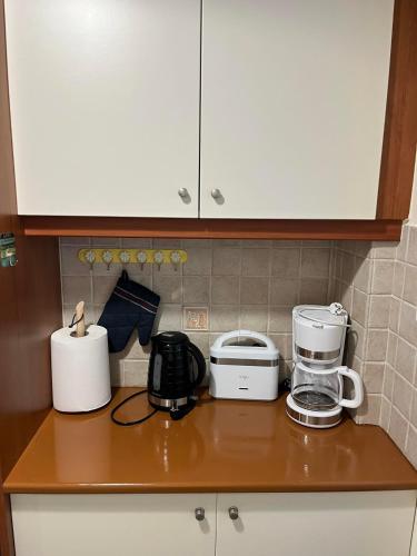 Η κουζίνα ή μικρή κουζίνα στο Spata Airside Apartment