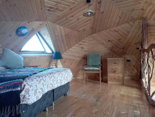 Postelja oz. postelje v sobi nastanitve Domos Arcoiris de Chiloé