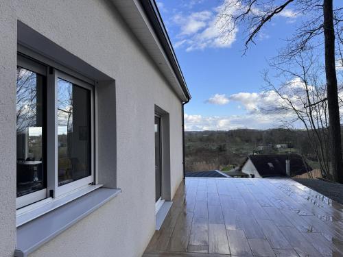 a balcony of a house with a window at Le Bellevue 6 pers Campagne Reve au Mans in Montfort-le-Gesnois